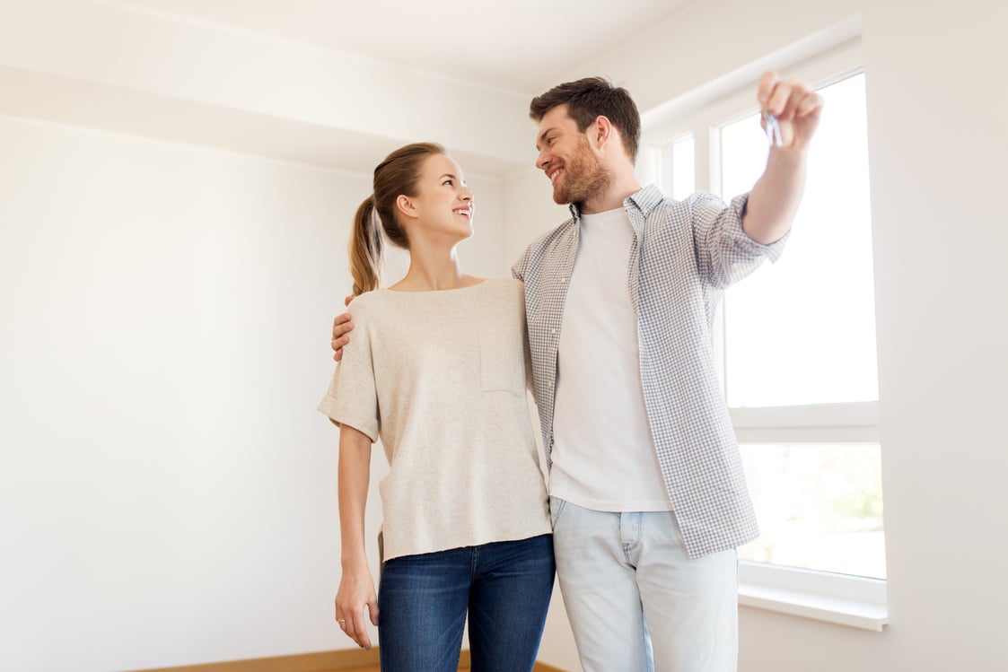 Happy Couple with Keys of New Home